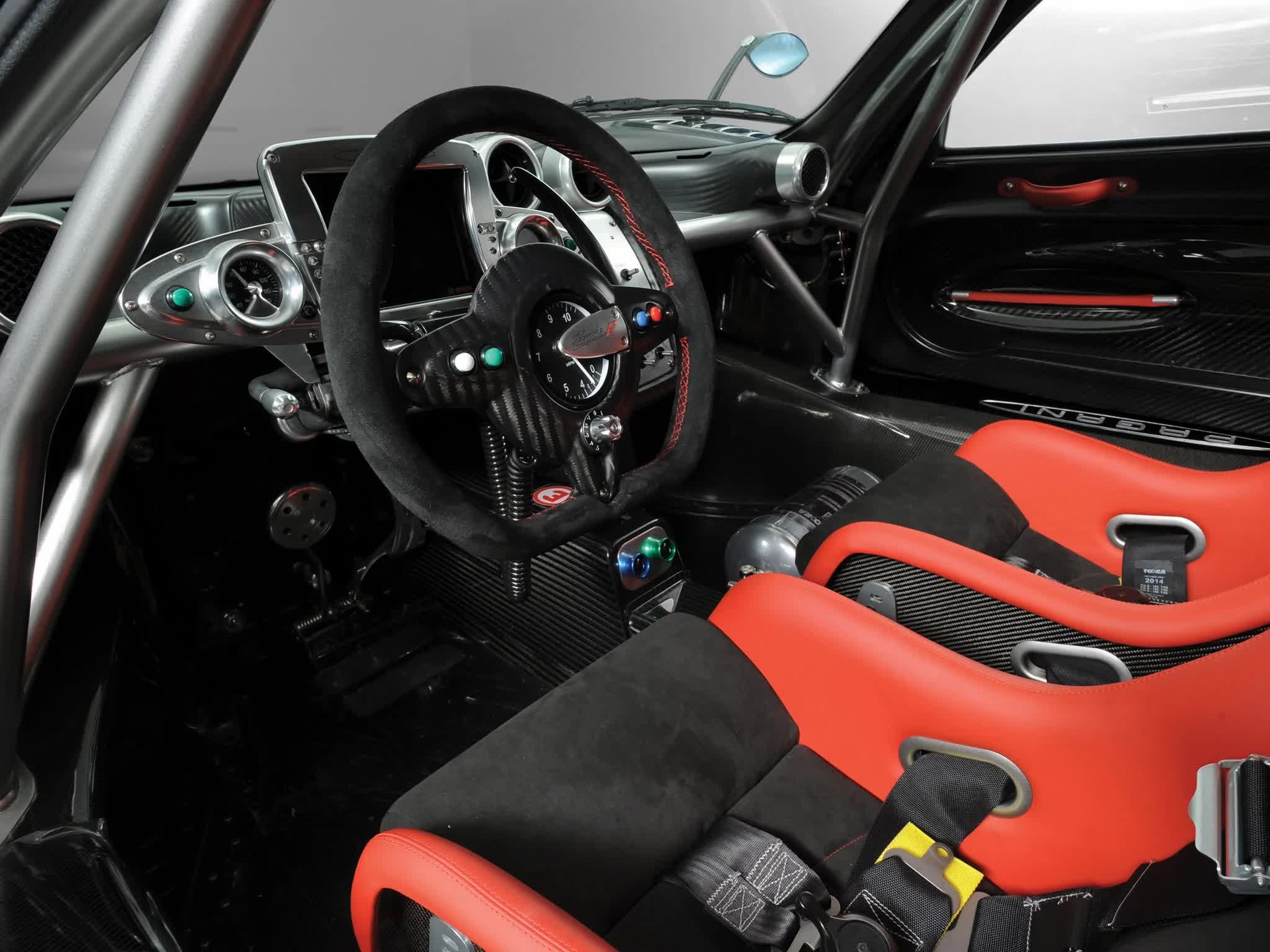 Pagani Zonda R — interior cockpit with carbon fiber, race steering wheel, and red Alcantara seats